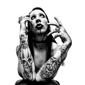 Platon Instagram - marilyn manson. “I took this picture in 1997 while Marilyn Manson was on tour in Hawaii. We transformed the infamous hotel suite where Elvis used to stay into my photo studio. Manson was polite, mild-mannered and introverted - yet also a dynamic visual collaborator. We talked about hypocrisy and failed leadership while a tropical storm raged in paradise that day. I took him outside onto the balcony overlooking the windswept palm trees. Although I focused on the tormented background scene, you can still see all the scars on his chest from his violent stage act. Now, Marilyn Manson is 50 years old, and so am I. Here’s to being a true cultural provocateur. Marilyn Manson, I salute you.”