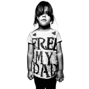 Platon Instagram - evelyn valazquez.
“This is Evelyn, she was 3 years old when I took this picture. Her father had been placed in a detention center for working with false documents. I saw the little girl marching with her mother at an immigration reform rally in Arizona, I knew instantly that the message on her t-shirt along with her beautiful spirit would be a powerful statement. I asked her mother if I could take a picture of her daughter, she agreed but then the little girl refused - she was too shy - she did what my children would do with a stranger and hid behind her mothers legs. This was not the picture I wanted to take - a victimized child running from authority. So I had to earn her trust by playing balloons with her for 5 and a half hours. I never had to earn trust like that with any of the powerful politicians or hollywood celebrities I’ve had the privilege to work with. Eventually Evelyn pointed to me and said “PICTURE NOW.” I had passed her audition. I took this picture with a steadfast conviction that this had to be one of the most important photos of my career. She stands not as a victim but as an empowered little girl filled with hope. I congratulated her mother for having such a well behaved little girl, and her mother told her daughter “the photographer man is very happy!” Evelyn replies, “IF I DID SO GOOD, DOES THAT MEAN DADDY CAN COME HOME NOW?” Perhaps our politicians can explain to Evelyn why her family must be separated. I certainly cannot.” To meet more of the heroes of our time head over to The People's Portfolio - @peoplesportfolio