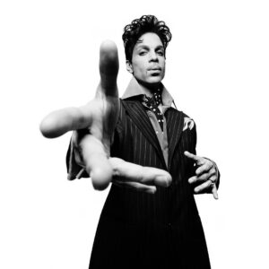 Platon Instagram - prince. "To spend the day with Prince is a rare and special thing. He was performing in Nashville, Tennessee and I was to photograph him backstage moments before he would thrill 20,000 people. He was introspective but surprisingly generous. He invited me to his sound check - I was mesmerized as he played every single instrument, making constant adjustments with the sound technicians. Even the drum kit was put through a rigorous examination. Every cymbal, every tom tom, the bass drum, and finally the snare. It was an exhaustive process of perfection and complete control - time stood still. I built my studio behind the stage and he waited until the arena was filled with screaming crowds before he finally appeared for me. I was overwhelmed, and he was calm - stately and tremendously trippy. I thanked him for providing a soundtrack to my youth. In particular, there was a song called Pop Life - an amazing song. I played it every Saturday night as I dressed for a party - a ritual that helped me feel 200% alive. He listened to my scattered reminiscence and smiled that Prince smile - then he chuckled to himself. 'What's so funny?' I asked. He whispered, 'I used to get dressed to that song too.’ Prince, you were majestic, and if you're listening, I salute you."