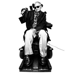 Platon Instagram - stephen hawking. "I photographed Professor Hawking in his personal office buried deep inside the Department of Mathematical Sciences at Cambridge University, England. The room was dominated by an oversized blackboard filled with chalked algebra equations. Pictures of Marylyn Monroe were scattered on all remaining walls. The professor was brought in by a team of medical nurses and a technical adviser. I was asked to leave the room so they could have some privacy to prepare him for my sitting - and prepared he was! HE HAS A POWERFUL PRESENCE. SILENT. MOTIONLESS. YET, 200% ALIVE. THIS MAN RADIATES CHARISMA - HIS EYES BURN WITH FIRE. He rocked a dapper tweed jacket with a silk cravat, which elegantly covered up all the plastic tubes entering his fragile body. He was engulfed by a mechanical throne-like wheel chair, in my opinion it only added to this man’s stature. At one point his eyes became sensitive to my lighting and during a quick break his nurse fitted his sunglasses. Suddenly, it all happened - rock star swagger. Here is professor Stephen Hawking as Platon sees him, a badass super hero. Professor Hawking, I salute you.”