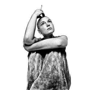 Platon Instagram - Sinéad O’Connor visited my New York studio with her son. The day she arrived a neighbor was doing some renovations to their bathroom and there was a pile of discarded building materials outside my studio door. “Sorry for the mess,” I said. “Never apologize for reality,” she replied. I was so excited to work with her. She seemed a little fragile but was upbeat and candid. As she walked into my space she glanced at my large Prince portrait hanging on the wall. “Oh dear,” she whispered, “I didn’t like him.” She then told me about a bizarre evening she had spent with Prince at his house. During our shoot there was no posing—just words, stories, gestures, and ideas. She constantly smoked a cigarette which naturally ended up in my picture. We talked about our favorite scenes in movies. “What do you think of Hitchcock?” I asked. “Psycho—shower scene—the best,” she replied. Sinéad went on to describe the vulnerability of Janet Leigh’s naked character and the foggy menace of her killer—seen through the shower curtain. “It still haunts me,” she said with growing emotion, “it’s terrifying.” As our session drew to a close and we all said our goodbyes on my doorstep, I noticed a mottled sheet of bathroom glass on the pile of building materials waiting to be collected by a contractor. I had an idea—“Wait!” I said, “I need you for two more minutes.” My assistants carried the sheet of glass into my hallway and held it up against the wall—I asked Sinéad to stand behind while I loaded my Leica with a roll of film. Sinéad obliged but seemed confused. “What are we doing?” she said. “It’s the shower curtain,” I said, “from Psycho.” “Ah, I love it!” she replied, “but I wonder, am I the hunter or the hunted?” Sinéad you were majestic, honest and brave. I salute you. Rest In Peace.