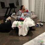 Porsha Williams Guobadia Instagram - I think our best piece of furniture is my recliner! lol I used to sit in it all the time when I was pregnant with Pj to help relieve my hip pains! BUT now it’s the perfect snuggle chair for my whittle family we literally try to beat each other to get in it😂🤗 Oh and yes I force hubby to wear holiday onsies with me almost everyday day 😂🥰 3 christmas later with you ❤️