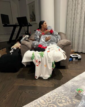 Porsha Williams Instagram - I think our best piece of furniture is my recliner! lol I used to sit in it all the time when I was pregnant with Pj to help relieve my hip pains! BUT now it’s the perfect snuggle chair for my whittle family we literally try to beat each other to get in it😂🤗

Oh and yes I force hubby to wear holiday onsies with me almost everyday day 😂🥰 3 christmas later with you ❤️