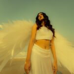 Priya Varrier Instagram - She fell from the skies above; Right onto the lap of his dreams 🕊️ Concept and Photography: @a_isography HMU: @sreegeshvasan_makeupartist Outfit: @jaankibridalcouture Art: @ashi_k_pradeep