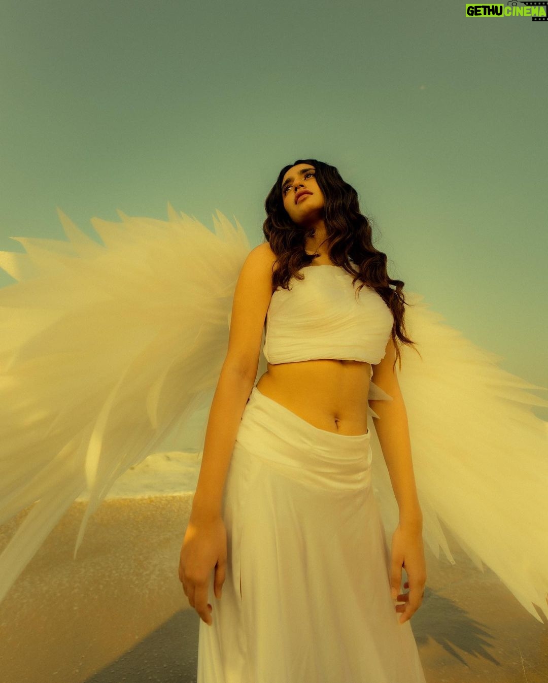 Priya Varrier Instagram - She fell from the skies above; Right onto the lap of his dreams 🕊️ Concept and Photography: @a_isography HMU: @sreegeshvasan_makeupartist Outfit: @jaankibridalcouture Art: @ashi_k_pradeep