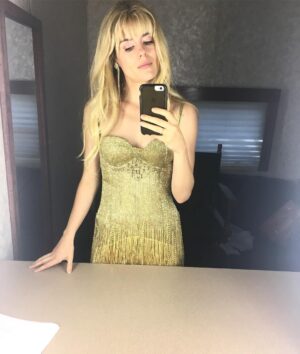 Rachael Taylor Instagram - Didn't anticipate this in TWs wardrobe but cray things can happen 😉 p.s it weighed like 20 pounds so mad respect for Britney as one of her dresses inspired this one 👑 Costume designer @lizvastola and @lapelaureate SLAYED & best make up EVER by @lkmua - all our naughties pop dreams came true for one glitter covered moment 😂😂😂😂#jessicajones #setlife 🎤