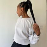Rae Wynn-Grant Instagram - A lot’s been going on since I last posted (personally & in the world) but would rather focus on how I got my hair braided & look like a @onepeloton instructor & managed to wear a white shirt for a full half-day before getting it stained. It’s the little things sometimes. Also, we’ve been living with a blank bedroom wall for almost 2 years - pls send art recs 🙏🏾. Braids by @alicianicole186 Paparazzi pics by @daveseligman Unintentionally asymmetrical ear piercings by @clairesstores circa 1991 Santa Barbara, California