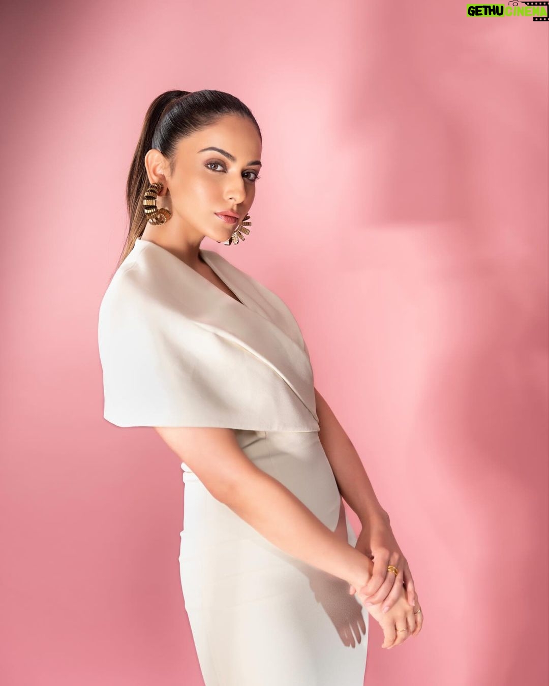 Rakul Preet Singh Instagram - White swan š¤ Outfit @safiyaa_official Earrings @amamajewels Ring @misho_designs Footwear @rossobrunelloofficial Styled by @anshikaav Assisted by @bhatia_tanisha Makeup @im__sal Hair @aliyashaik28 Shot by @deepak_das_photography