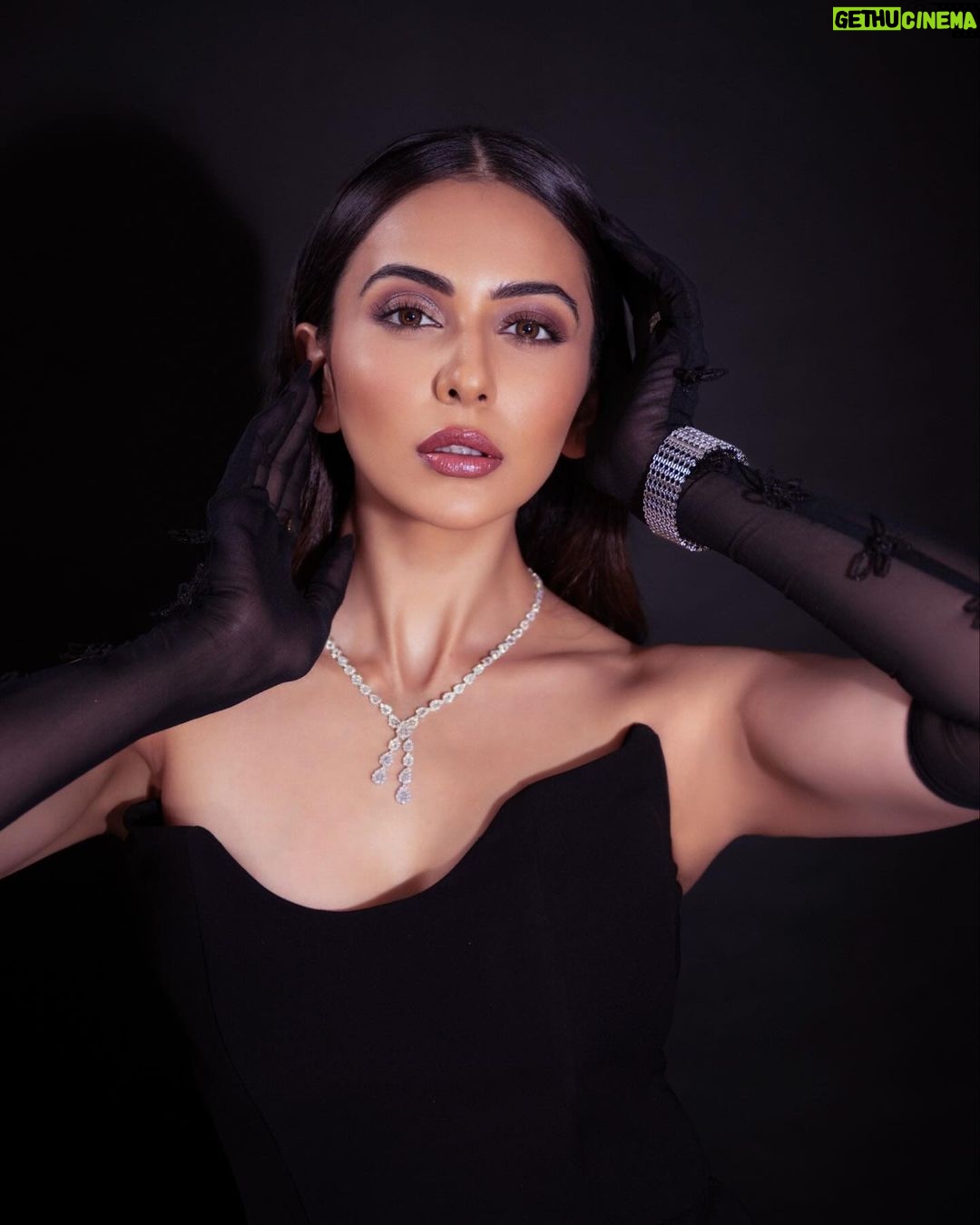 Rakul Preet Singh Instagram - Black is mystery 🖤 Outfit @stada_couture Jewellery @notandas_jewellers Gloves @labelankitajain Footwear @rossobrunelloofficial Styled by @anshikaav Assisted by @bhatia_tanisha Makeup @im__sal Hair @aliyashaik28 Shot by @deepak_das_photography