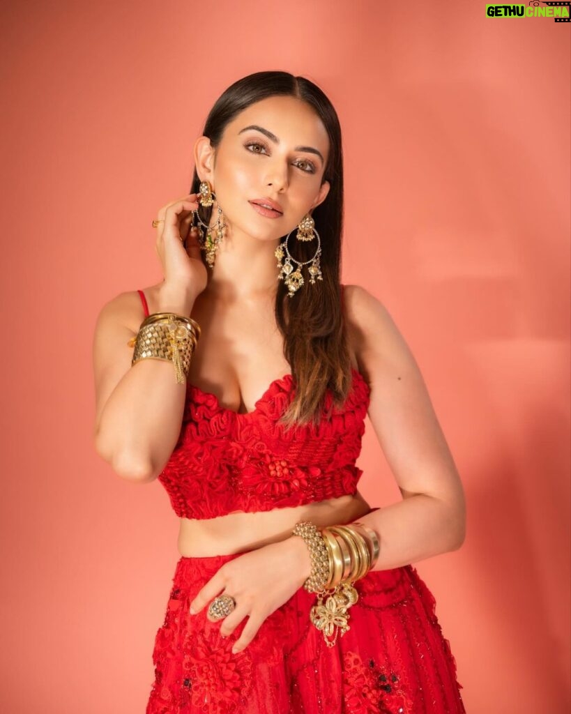 Rakul Preet Singh Instagram - Life is simple , it’s either cherry red or any other red ❤️ Outfit @shivanandnarresh Earrings @abhilasha_pret_jewelery Ring @abhilasha_pret_jewelery Bangles @sachdeva.ritika Styled by @anshikaav Assisted by @bhatia_tanisha Makeup @im__sal Hair @aliyashaik28 Photographer- @deepak_das_photography