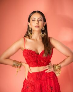 Rakul Preet Singh Instagram - Life is simple , it’s either cherry red or any other red ❤️ Outfit @shivanandnarresh Earrings @abhilasha_pret_jewelery Ring @abhilasha_pret_jewelery Bangles @sachdeva.ritika Styled by @anshikaav Assisted by @bhatia_tanisha Makeup @im__sal Hair @aliyashaik28 Photographer- @deepak_das_photography
