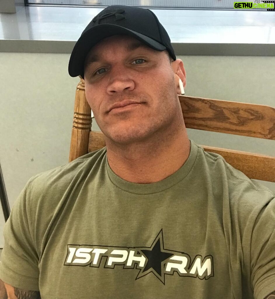 Randy Orton Instagram - Heading home @kim.orton01 👍🏼 listening to ‘Sacrifices’ by @bigsean and @Migos. Wish I knew who those dudes were when I ran into them in STL couple years ago. RKO Drip Outta Nowhere has a nice ring to it. Oh yeah, reppin #1stphorm @1stphorm and yes, I’m sitting in a rocking chair come at me bro Buffalo Niagara International Airport