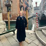 Rebecca Flint Instagram – photodump: Venice 🇮🇹 📍

1. A view from above St Mark’s Cathedral wearing my vintage gunne sax from @elindiovintage ✨
2. Sun down the canals
3. over 8,000 square metres of mosaics at the cathedral
4. channeling dorothy wizard of oz, or wednesday addams, not sure 
5. single file please
6. 1 tea and 1 hot choco price at Caffe Florian 😵‍💫

#vintageprairiedress #70sprairiedress #prairiedressobsessed #prairiedress #charityshopfashion #edwardianfashion #70sdress  #softgirl #softgirlaesthetic #romanticstyle #canaletto #neobaroque #canalettoandvenice #canalettovenezia #baroquearchitecture #venicebiennale #18thcentury #historical #historylovers #neoclassicism #venicelife #venezia #veneziaunica #biennaledivenezia #historyofart #historyart #arthistorynerd #classicalpainting #arthistory #classicalart St. Mark’s Cathedral