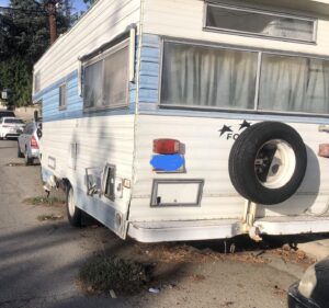 Rick Dees Instagram - Our “Name the City” contest continues… This RV has been ILLEGALLY PARKED in this one spot for almost 3 years. As you can see, GRASS is growing on the pavement around the wheels. Hint: It’s 1/2 mike from a famous theme park.
Can you name the city?