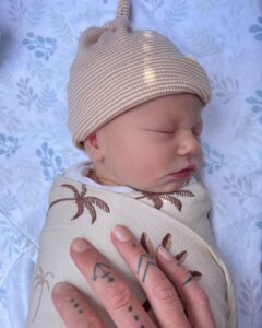 Riley Elliott Instagram - So we had a baby girl!!!! ✨ Sailor Jane Elliott ✨ Born 3rd October, 3.3kg. I’ve held baby sharks before, a few human ones here and there, but never have I experienced something quite like this. After an amazing labour by Amber, where she did 3/4 of the labour at home, we were surrounded by the most incredible team of women at North Shore Hospital. I was instructed by our midwife to catch my very own baby girl as she came into the world. From her very first moment in this world she was eyes open, super inquisitive and has been a dream so far, peacefully observing her new world with us. She’s already been in the water with Great Whites for Shark Week (inside mummy), has a wolf for a brother, and will likely live a very oceanic life. Lots of love little Sailor. And Amber, I am and always will be blown away by your strength and beauty xxx