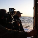 Riley Elliott Instagram - @sharkweek kicks off tomorrow in the northern hemisphere on @discovery channel and Discovery Plus. Super excited to see what my fellow shark week crew got up to. It’s such an exciting time of year to share new technology, new places, and new sharks. I generally take this whole week off and nestle in with some beers and snacks. Don’t know about you? But I just love not only the sharks but also the different ways each crew tells a story, shows us something new, and ultimately creates a tv production. Such a dream job so thank you everyone who helps make these missions happen. Happy Shark Week to all