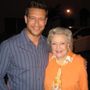 Robert Gant Instagram - I’m sad to hear of the passing of @bettymwhite today. What a wonderful life fully lived. So many people touched and impacted.

When I had the good fortune to work with her on “Hot in Cleveland,” we did what’s called a speed through in the makeup room on taping day. A speed through is essentially the process of whipping through the lines of an entire episode to refresh them quickly before going live in front of an audience. Because it was only the third episode, everyone was especially energized as the show was still finding its feet. Betty’s “date” for the episode was none other than the amazing Carl Reiner, who passed away last year. As we all sat in a circle zipping through our lines, one of my fellow guest stars leaned over and, referring to Betty and Carl, whispered, “Can you believe we’re sitting here doing a speed through with two of the progenitors of comedy?” For indeed we were. And indeed they were.

When we were about to start shooting, Betty came in and found a chair next to me just off the set where we were both to be making our entrances. She sighed a big sigh as she sat, and I said, “How are you doing?” She didn’t miss a beat and asked, “Is it time to go home yet?” I laughed, and we chatted for a bit. I’ll never forget the experience. 

I guess now it really was time to go home. Rest well, Betty.