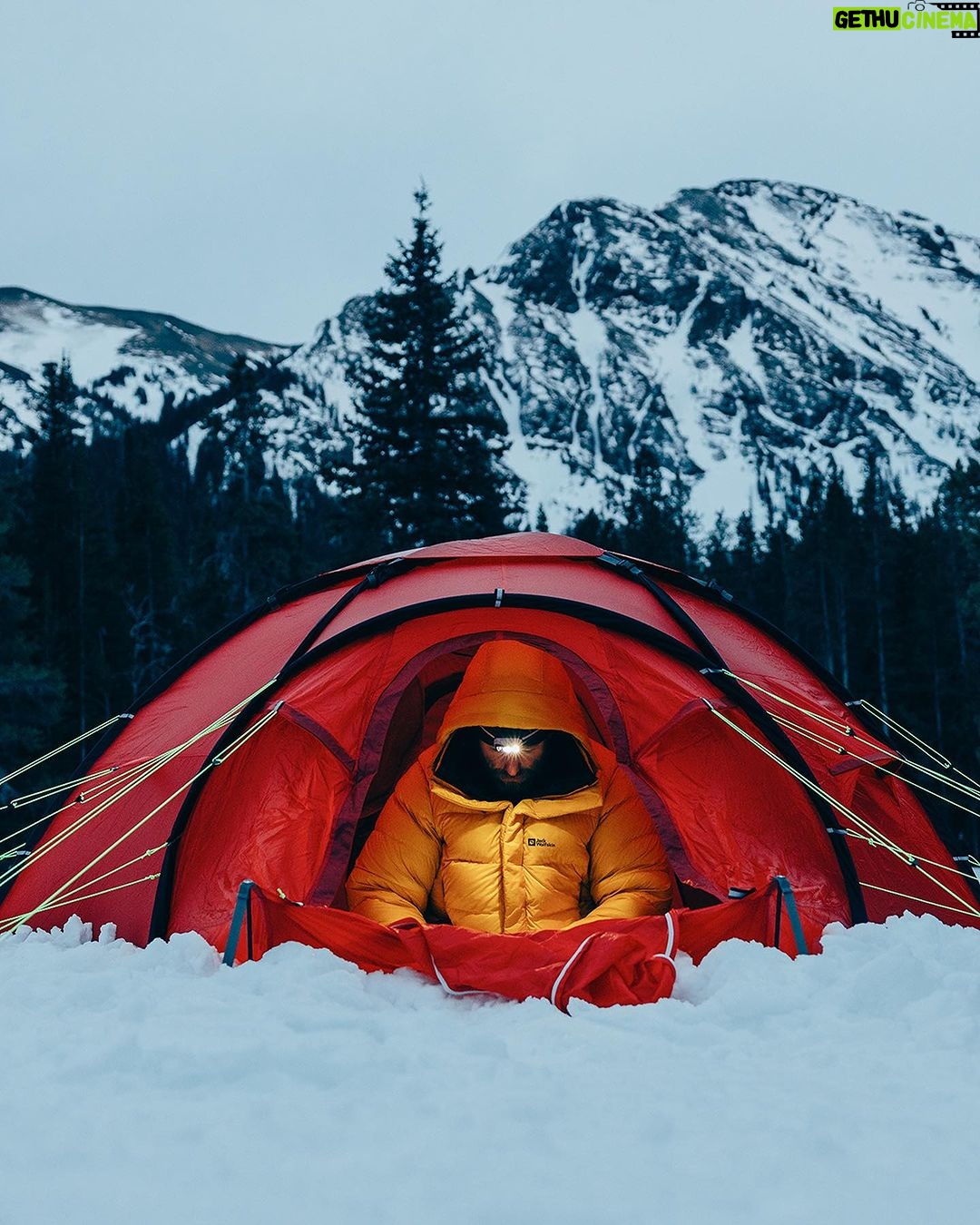 Ronan Donovan Instagram - Winter is by far my favorite time to look for wolves in Yellowstone. Swipe to see one of Yellowstone’s famous wolves, Mr. Blue, checking me out from afar back in 2015. 📷: @willsaundersphoto @jackwolfskin #jackwolfskin Yellowstone National Park