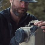 Ronan Donovan Instagram - The wolves in Yellowstone can still be hunted and trapped when they leave the safety of the park’s boundary during the winter months. As a result, they are shy in comparison to wolves that aren’t hunted by humans and it can be challenging to take photos of them. @ronan_donovan uses camera traps to be able to capture images of wolves moving through their home ranges. #jackwolfskin #welivetodiscover #rewildtheworld #rewildourselves Yellowstone National Park