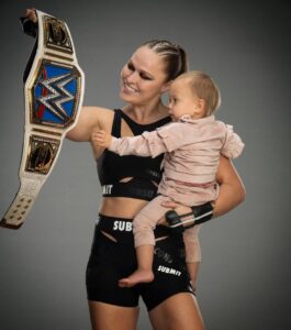 Ronda Rousey Instagram - Open challenge tonight - my baby likes the shiny thing, see what happens to anyone with the gumption to try and take it 😈 tonight on #smackdown @fs1