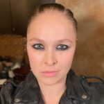 Ronda Rousey Instagram - Let’s take a second to appreciate those braids by @thisisbabe, makeup by @mariko_hirano and those aptly named @prada #monolith boots- here’s @charlottewwe fully appreciating one of the boots