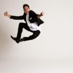 Russell Kane Instagram – 2024 TOUR UPDATE:
Yes! Hurrah! Some dates WILL be going on sale BEFORE Crimbo.
The first leg of the tour will be in smaller rooms (as requested by you lot) 300-800 seaters. These more intimate shows will go on sale any day now. 
The second leg of the 2024 tour, bigger rooms (but never arenas), will go on sale early next year.
The show? It’s called HyperReactive. 
And I plan to burn more calories than ever! 
Russell 🙂