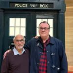 Russell T Davies Instagram - Happy New Year’s Eve! And the point is - there, right behind us, that’s one of the sets from the Christmas 2024 episode of Doctor Who! The future! Right there ♥️ But what terrible secrets does it hide..? (etc) @bbcdoctorwho @bbcone @bbciplayer @disneyplus #2024 Bad Wolf Studios