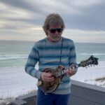 Sam Bush Instagram - Happy Holidays to all you Music Lovers. May you enjoy the Holiday of your choice with those you choose. With Yuletidings & gay apparel we wish y’all a very Merry Christmas 🎄🎁 Sam, Lynn & the Sam Band Family