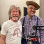Sam Bush Instagram - Sam recently paid a visit to the great @domflemons in Nashville to record an episode of Dom’s American Songster Radio Show (@wsmradio)! They talk about Sam's experience learning how to play fiddle, being part of the bluegrass community, and his new album “RADIO JOHN: THE SONGS OF JOHN HARTFORD.” Enjoy a quick jam session too. Listen to the episode here: https://wsmradio.com/shows/american-songster-radio/ #sambush #donflemons #americansongsterradioshow #newgrass #bluegrass