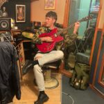 Sam Palladio Instagram - Cooking up some tunes in London with @connors_danny & @andyhallhall. Using an AA battery as a slide guitar Battersea Power Station