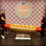 Samm Levine Instagram - When @mlb invites you to eat the specialty food from all 30 of its teams and stadiums in one place, you grab @heyitsjohnk and you do it. You must also ride the hotdog seesaw. Rules are rules. #mlbfoodfest