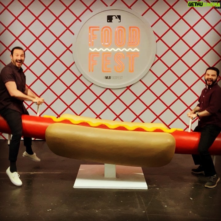 Samm Levine Instagram - When @mlb invites you to eat the specialty food from all 30 of its teams and stadiums in one place, you grab @heyitsjohnk and you do it. You must also ride the hotdog seesaw. Rules are rules. #mlbfoodfest