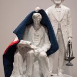 Sanford Biggers Instagram - ‘Lifting The Veil’ (2023) White Carrara marble, antique quilt H: 45.5 in x W: 30.38 in x D: 28.95 📸 3: ‘Booker T. Washington Lifting The Veil of Ignorance’ Inscription: “He lifted the veil of ignorance from his people and pointed the way to progress through education and industry.” #studiosanfordbiggers #remancipationproject #history #frederickdouglass #abrahamlincoln #bookertwashington Chazen Museum of Art