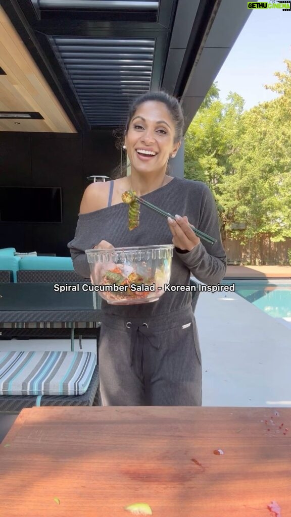 Sangita Patel Instagram - Spiral Cucumber Salad - Korean Inspired 🥒 This is my first time trying this oh-so-fun salad I give it a 9/10 - watch till the end when gochugaru hits me 😂 But the accordion shape really holds the flavour in every bite! @feedmi_ thank you for recipe just added more veggies to it! Recipe 4-6 mini cucumbers 1/2 cup of red onions sliced 1/2 cup of carrots sliced 1 green onion 2 Tbsp of gochugaru (Korean chilli flakes) I would reduce this to 1, lol. 3 Tbsp rice vinegar 1 Tbsp sesame oil 3 garlic cloves, minced 1 tsp sugar 1 Tbsp sesame seed Give it a try! #CookinWSangi #SaladButNoLettuce #Fusion #fun #spiralcucumber