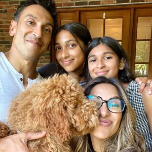 Sangita Patel Instagram - This photo was taken an hour before I said YES 💍 
I just got my Engineering degree the day before and then Sam whisked me away to Bahamas. Little did I know he had already met with my family and asked for their blessing 🥰 (my sisters kept a secret from me, how dare they 😂)

Sam got on one knee (same height as me when he kneels😊) I was complaining about the bugs on the beach and missed the whole ‘will you marry me’ I’m pretty sure I said Holy 💩 

20 YEARS! 
The moments, 
the memories, 
the ride….what 👏🏽 an 👏🏽 incredible 👏🏽 ride!

I think the best way to explain the carousel is K-I-S-S-I-N-G nursery rhyme, remember?!
First come love ❤️ 
then comes marriage 💍
Then came Ava and Shyla in a baby carriage 🍼
Oh and Indie 🐶 

Happy 20th Anniversary Sam (still checking you out, hubba hubba 😉❤️ 

#20thWeddingAnniversary #Myjoy #Mylife #laughter