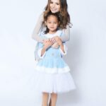 Sasha Clements Instagram - For the first time in my career I got to play a Mom!!! Meet my movie daughter @vanessa_fox_official ❤️ I was so nervous to meet her! I kept asking Corbin "What if she doesn't like me??" lol. But we quickly became besties because not only is she the sweetest thing to walk this planet but also such a pro to work with! ⁠⁠ ⁠⁠ During our night shoots she would hold my hands between her mittens filled with hand warmers so I wouldn't get cold😩 She taught me the latest TikTok dances and on days where my body was secretly killing me, she was my little rock and the best distraction! ⁠⁠ ⁠⁠ I cannot wait for you to see her cuteness in #AChristmasDanceReunion! Thank you @BrianHerzlinger & @meggsherzy for making me a parent 🤣 ⁠⁠ ⁠⁠ Watch the premiere Dec. 3rd on @lifetimetv 🎄⁠⁠