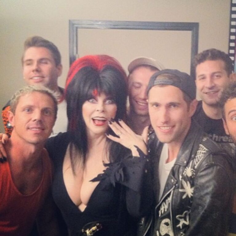 Seth Bogart Instagram - 10 years ago I went to see Elvira’s show at Knott’s Scary Farm. She did a spoof of one of my friends songs so we got to meet her after the show. Just before we headed backstage I got introduced to a man in a baseball hat. As I was shaking his hand I looked up into his eyes and he said, “I’m Paul.” HOLY SHIT ! It was Pee Wee. He walked backstage with us to see Elvira (his good friend obviously.) I guess he thought we were cool cuz he ended up walking around Knotts Berry Farm with us for a couple hours. We were escorted by a theme park professional and got to skip all the lines. Pee Wee didn’t do any rides or haunted houses, he would just wait at the exits for us- why I do not know!! All my friends commented that he had hot Big Top energy lol. Before he left he stopped us and pointed at a candy store and in a totally Pee Wee voice said, “I know how to get free candy!” And then we went into the candy shop and he asked to sample everything and bought nothing. My hero.