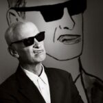 Seth Bogart Instagram - What an honor to design 3 collections of merchandise for the great new John Waters “Pope of Trash” show at @academymuseum ‼️ Seeing my art all huge on 2 walls at the end of the exhibit blew my mind. Love this pic @greggormanphoto took of John in front of my drawing of him. Just wait til you see the whole bathroom collection & the Divine/Pink Flamingos collection - both of those will be dropping sometime soon. Go see the show !!! Academy Museum of Motion Pictures