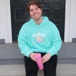 Shane Dawson Instagram - I like having his name on my chest so the zero people that hit on me know that I’m taken. 💪🏻🐷👍🏻 New Ryland hoodie and pink pig cup up now on my merch site! (link in bio) ❤️