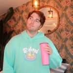 Shane Dawson Instagram - I like having his name on my chest so the zero people that hit on me know that I’m taken. 💪🏻🐷👍🏻 New Ryland hoodie and pink pig cup up now on my merch site! (link in bio) ❤️