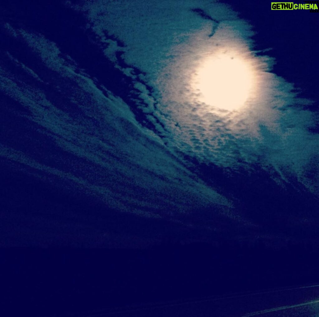 Shaun Johnston Instagram - A big ol’ full moon trying to hide in the clouds at 4:30 in the morning. Sj