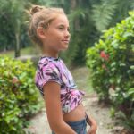 Shaylee Mansfield Instagram - Walk with nature barefoot for it connects you to your roots. Soak in all colors, shapes, and lines of leaves, trees, and plants for it tells you to love them as they are. Feel the wind for it gently pushes you to paths never crossed before and to appreciate trails that were carved by people who were wild… To be with the ground and sky freely, one must remember to not be tamed. #staytruetoyourself #wildandfreekids #strawberryblonde #blueeyes💙 #rooted #tropicalparadise Sanibel, Florida