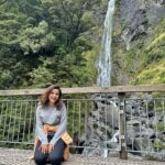 Shirley Setia Instagram - After what felt like a million steps later- saw this pretty lil waterfall 🌈💫 Since everyone keeps asking me photos koun le raha hai 📷: my phone & my tripod ✌🏻😅📱 #shirleytravels #shirleysetia #newzealand #arthurspass #southisland Arthur's Pass National Park