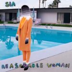 Sia Instagram - No ifs, and or bows about it 🎀 Sia's new album 'Reasonable Woman' is out everywhere this spring! The webstore pre-order is now live - grab the exclusive orange vinyl (limited to 500) there now - link in bio - Team Sia [image description: The cover of Sia's album 'Reasonable Woman' that shows her standing in front of a swimming pool in an orange suit.]