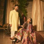 Sonam Kapoor Instagram - Wearing this @jigyam ensemble is what Indian textile dreams are made of! it’s my bffs wedding and this was the perfect chance for me to wear a beautiful outfit that was made from actual vintage old banarasee saree with real gold weave with all antique techniques of surface embroidery; they have added all vintage tassels with shells and pearls and the dupatta is embroidered with vintage mochi work pieces which are over 60 years old and is one of the finest techniques of embroidery from Gujarat. All the silver jewellery are actual antique pieces which have been collected over a period of time and payal and bangles are more then 80-90 years old antique pieces! Anand on the other hand is wearing gorgeous resham work kurta from @abujanisandeepkhosla which is a collectible heirloom. Each piece of theirs takes months to make. My jutti is @fizzygoblet and Anands is @rajeshpratapsinghworks 📸 @sheldon.santos #madeinindia #everydayphenomenal💫 #proudindian #textileheaven