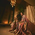 Sonam Kapoor Instagram - Wearing this @jigyam ensemble is what Indian textile dreams are made of! it’s my bffs wedding and this was the perfect chance for me to wear a beautiful outfit that was made from actual vintage old banarasee saree with real gold weave with all antique techniques of surface embroidery; they have added all vintage tassels with shells and pearls and the dupatta is embroidered with vintage mochi work pieces which are over 60 years old and is one of the finest techniques of embroidery from Gujarat. All the silver jewellery are actual antique pieces which have been collected over a period of time and payal and bangles are more then 80-90 years old antique pieces! Anand on the other hand is wearing gorgeous resham work kurta from @abujanisandeepkhosla which is a collectible heirloom. Each piece of theirs takes months to make. My jutti is @fizzygoblet and Anands is @rajeshpratapsinghworks 📸 @sheldon.santos #madeinindia #everydayphenomenal💫 #proudindian #textileheaven