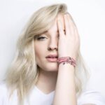 Sophie Turner Instagram - On #WorldChildrensDay it’s exciting for me to announce my collaboration with #LVforUNICEF to design a friendship bracelet. I want to explain the significance of the colors and also the charm that I designed. As we know, LV is known for being a brand all about travel and so the brands identity itself is important when collaborating with a charity that is prevalent all over the world. It’s all about bringing people together. I wanted my bracelet to hold luck for all the children whom the proceeds from this bracelet go to. So I wanted to integrate the idea of luck and also inclusion of many countries and cultures. I wanted to have the braids made of two colours; red and white. Red is considered a lucky colour in China. And the white coincides with my idea for having the little circular charm on the bracelet, a rabbit. A. Because WHITE rabbits are considered very lucky in the UK and a rabbit foot is considered lucky in many parts of Europe, China, Africa, North and South America. It also has a little bit of me on there because I have the same rabbit designed tattooed on my arm by @curtmontgomerytattoos #MAKEAPROMISE 🐰 ✈️ 🐇