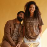 Spencer Paysinger Instagram - I’ve had a front row, backstage, VIP packaged experience seeing @blairpysngr build @post21shop. More than 2 years ago while pregnant with Madden and Cairo hanging off her arm, she tells me she wants to build her own table out of frustration with not being able to support dope black owned businesses under one cohesive marketplace. Fast forward to now and @post21shop has 350 products across 75 vendors (and growing.) The launch of P21’s first T-shirt (designed by @blairpysngr herself) pays homage to those initial creatives who agreed to work with us. The back represents the spine of our company — the undying spirit of Black Wall Street. This shirt is a milestone for @post21shop, a celebration of its vendors, and a history lesson for those who believe Black Wall Street ended in 1921. Proud of you love! — P21’s 1st Assistant. LINK IN BIO to purchase.