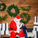 Spencer Paysinger Instagram - Started wearing the suit for Cairos 1st Christmas and it’s turned into somewhat a tradition. Now that I’ve taken my talents to @findyourhilltop via @post21shop, I don’t see this tradition stopping any time soon. The joy [and legit fear] the kids came with is too good to miss! #OldSaintSpence.