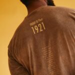 Spencer Paysinger Instagram - I’ve had a front row, backstage, VIP packaged experience seeing @blairpysngr build @post21shop. More than 2 years ago while pregnant with Madden and Cairo hanging off her arm, she tells me she wants to build her own table out of frustration with not being able to support dope black owned businesses under one cohesive marketplace. Fast forward to now and @post21shop has 350 products across 75 vendors (and growing.) The launch of P21’s first T-shirt (designed by @blairpysngr herself) pays homage to those initial creatives who agreed to work with us. The back represents the spine of our company — the undying spirit of Black Wall Street. This shirt is a milestone for @post21shop, a celebration of its vendors, and a history lesson for those who believe Black Wall Street ended in 1921. Proud of you love! — P21’s 1st Assistant. LINK IN BIO to purchase.